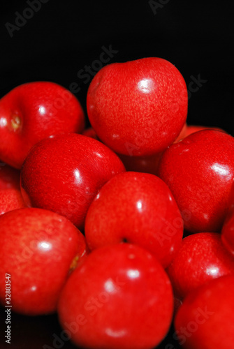 Photo: Sweet cherries isolated on black Sweet cherries isolated on black