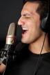 Rock artist recording his song in a studio