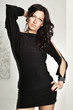 Studio shot of a young, beautiful, brunette, fashionable woman