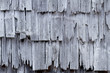 Shingles on the wall of a barn with hoarfrost