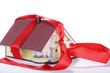 Haus in Geschenkband, Haus zu verschenken