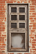 Window in an orange brick wall