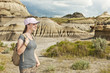 Hiker in badlands of Alberta, Canada