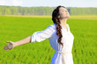 Young happy woman in green field. Young happy woman in green field.