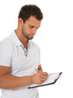 Fitnesstrainer notiert Trainingsplan
