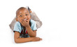Adorable black boy with a big smile laying on the floor Adorable black boy with a big smile laying on the floor