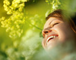 Happy young woman and wild flowers.