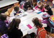 happy kids with teacher in school classroom happy kids with teacher in school classroom