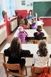 happy kids with  teacher in  school classroom