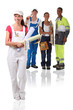 Photo: Young building workers isolated on white background Young building workers isolated on white background