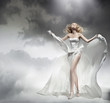 Romantic blond beauty posing in amazing dress