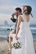 just married couple on the beach ride white scooter just married couple on the beach ride white scooter