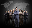 Businessmen standing in front of an earth map