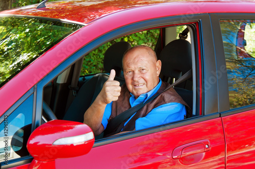 Photo: Senior as a car driver in the car. Senior as a car driver in the car.