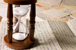 Hourglass on old letters