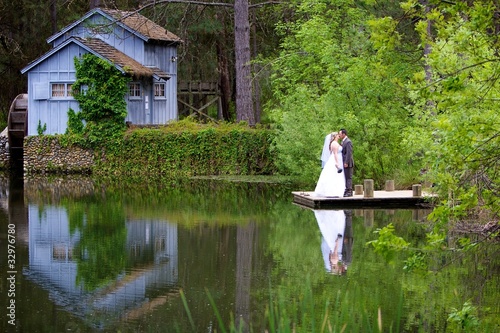 Photo: Wedding couple on a dock Wedding couple on a dock
