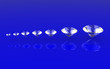 Seven size brilliant cut diamonds side perspective view Seven size brilliant cut diamonds side perspective view