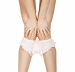Woman takes off her panties, isolated on white background. Woman takes off her panties, isolated on white background.