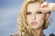 beautiful girl on background blue sky