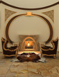 Armchairs near fireplace in modern interior. Warm