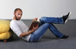 young man read a magazine on the floor