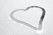 Heart shape drawn on white snow, love symbol Heart shape drawn on white snow, love symbol