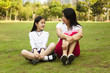 Photo: asian mother and daughter having a conversation asian mother and daughter having a conversation