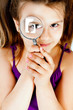 little girl with a magnifying glass