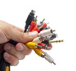 Audio and video plugs in hand Audio and video plugs in hand