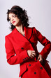 Foto: Beautiful young woman in red coat Beautiful young woman in red coat