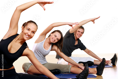 Photo: Group of People Doing Fitness Exercises Group of People Doing Fitness Exercises