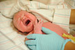 Newborn baby getting checked by doctor