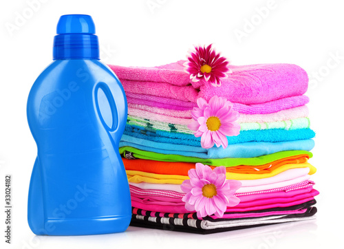 Photo: Pile of colorful clothes over white background Pile of colorful clothes over white background