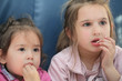 girls eating pop corn