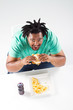 overhead view of african american man eating fast food