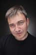 Foto: Confused young man in black T-shirt Confused young man in black T-shirt