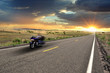 Biker on road Route 66 at sunset