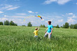 father with son in summer with kite