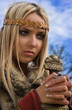 Viking girl on a blue sky background