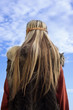 Viking girl on a blue sky background