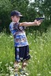 The boy shoots from a pistol