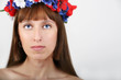 pretty Ukrainian woman with the wreath of flowers on the head