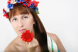 pretty Ukrainian woman with the wreath of flowers on the head