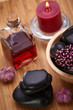 spa, black hot stones and essential oil