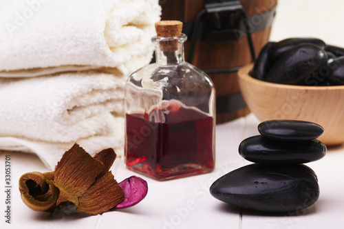 Photo: balanced stones, essential oil and towel balanced stones, essential oil and towel