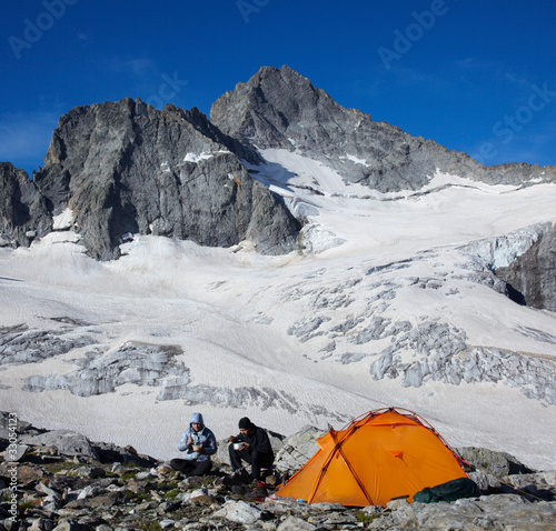 Photo: Couple of tourists having a breakfast Couple of tourists having a breakfast