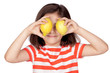 Photo: Brunette little girl with two lemons Brunette little girl with two lemons