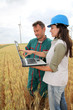farmer and engineer wind in wheat fields