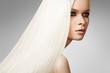 Portrait of beautiful model with straight shiny long blond hair