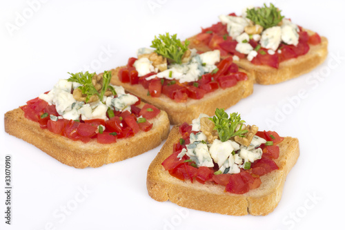 Photo: Appetizers with tomatoes and cheese decorated with parsley Appetizers with tomatoes and cheese decorated with parsley